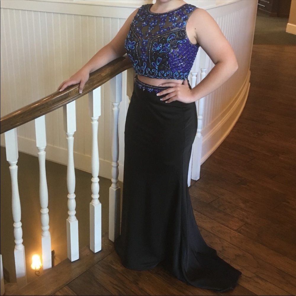 Black 2 piece prom dress with different shades of blue embellishments.
